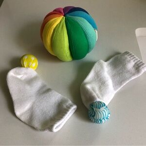Colorful Rainbow Ball and White Socks Set from Lovevery Playkit